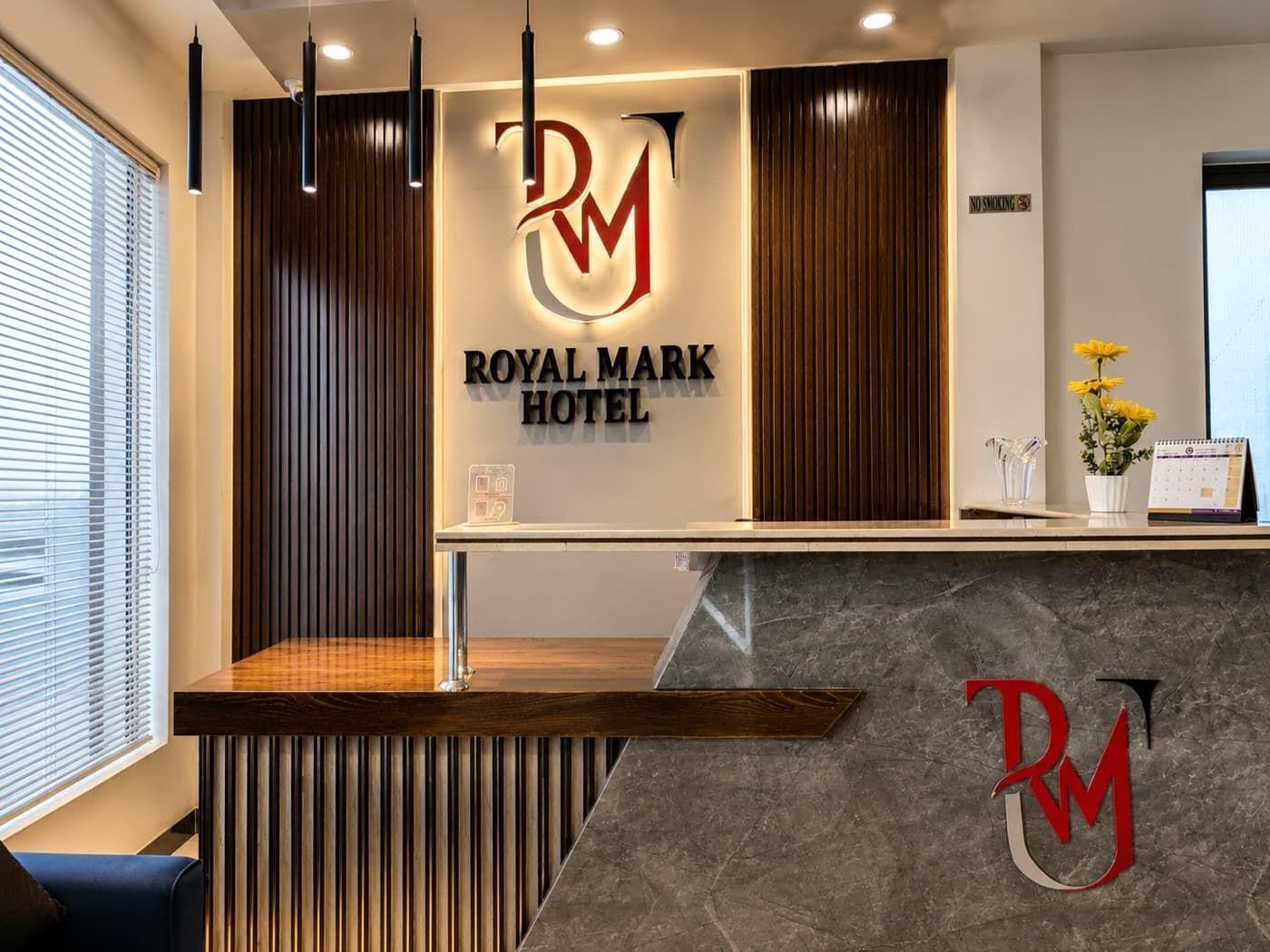 Royal Mark Hotel — the reception desk and RM signage